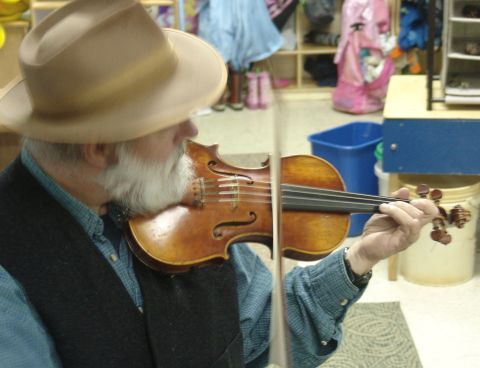 Hunt's fiddle bow flying at the  Surry Village Charter School Fall Festival