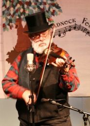 Hunt playing "Mr. Fezziwig's Ball" at the Nelson Solstice Party, 2009. Photo by Val van Meier.
